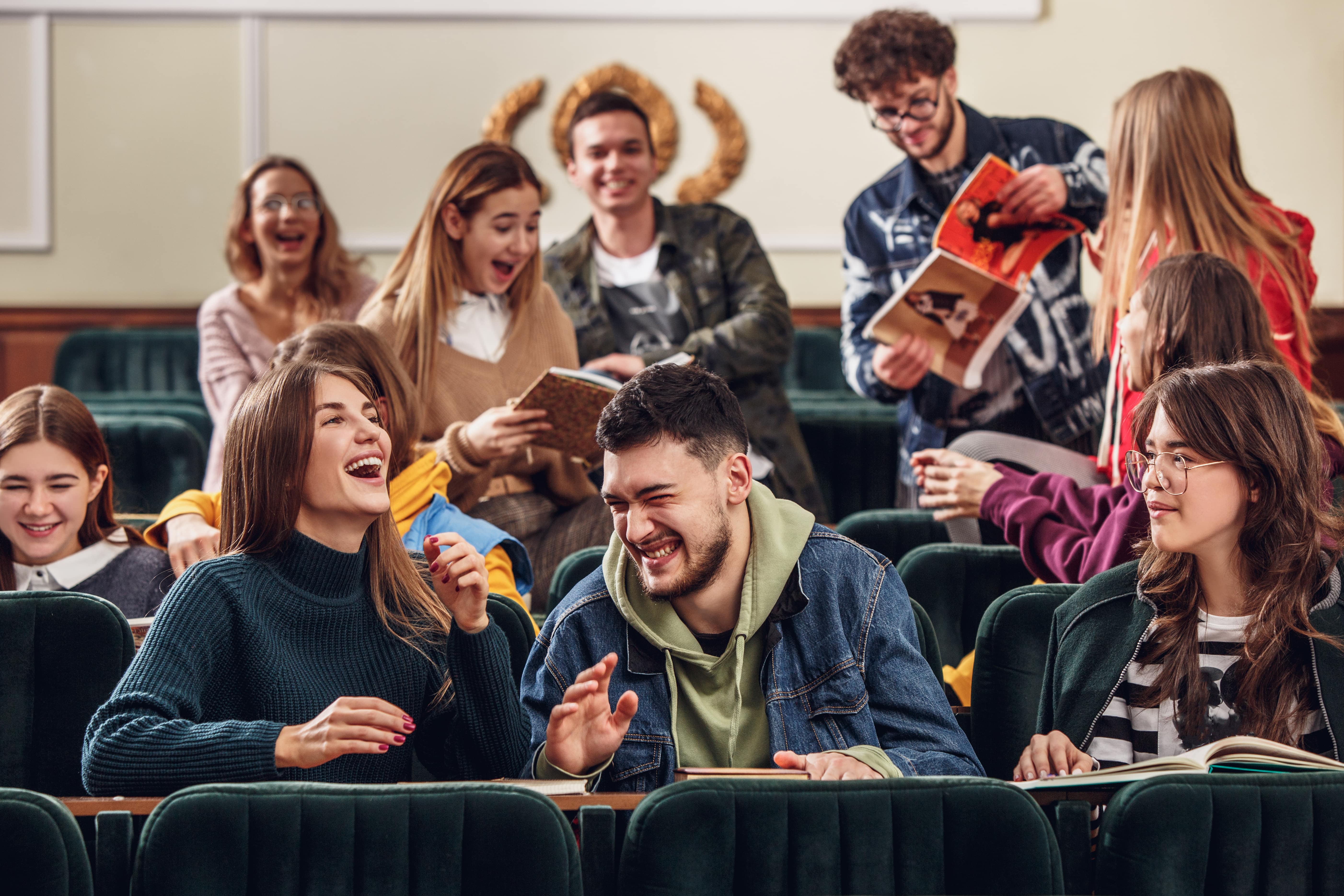 group cheerful happy students sitting lecture hall before lesson min